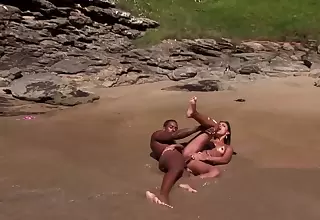 Curvy Brazilian porn goddess needs a big pecker on the beach