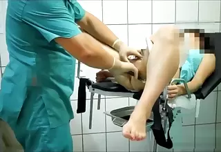 Precise examination of the patient on the gyno chairman